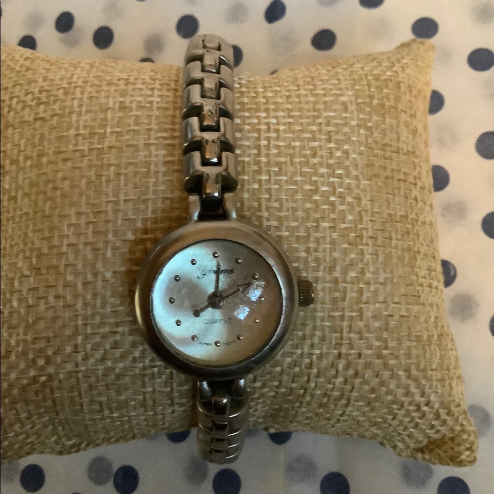 Silver tone band watch